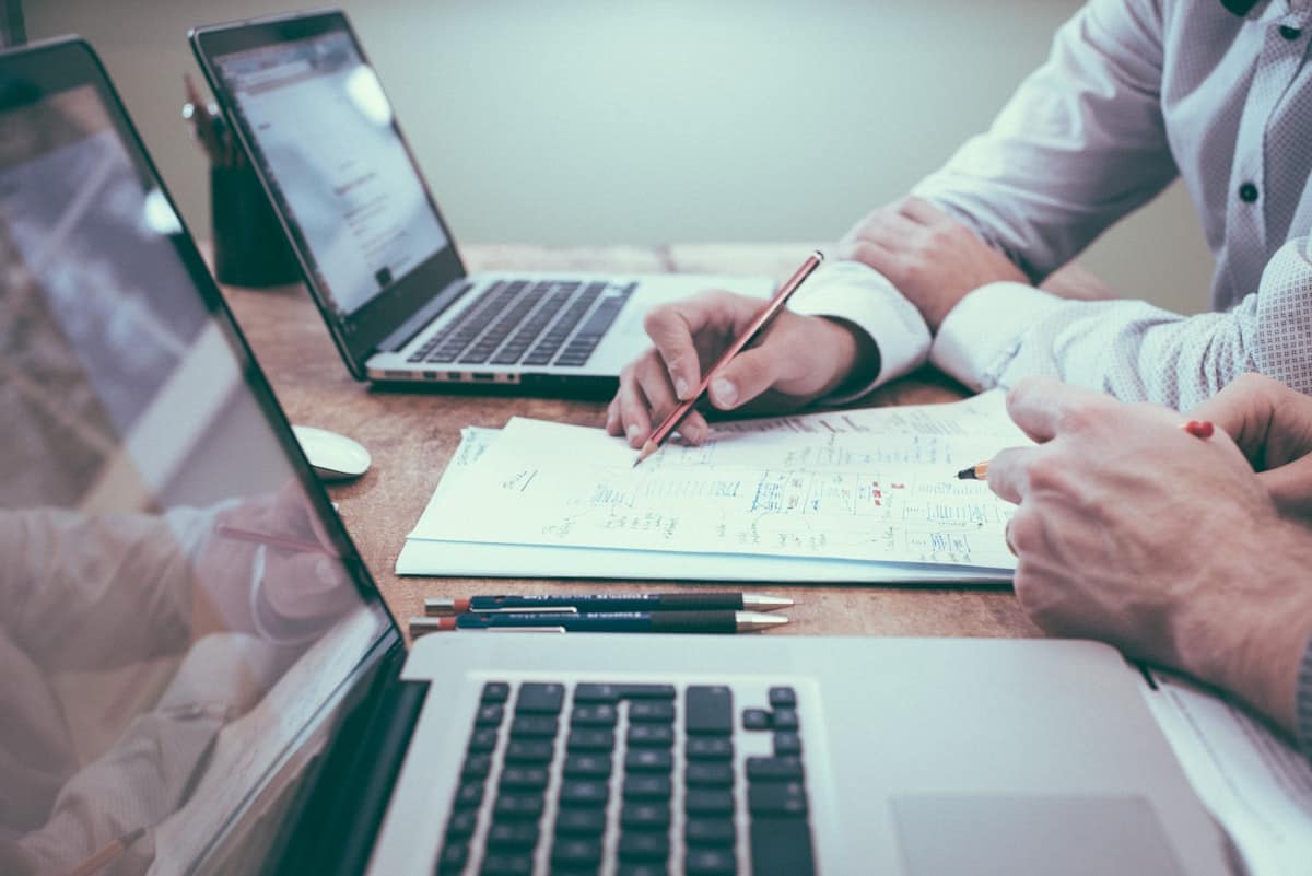 Tax consultants reviewing documents at a desk